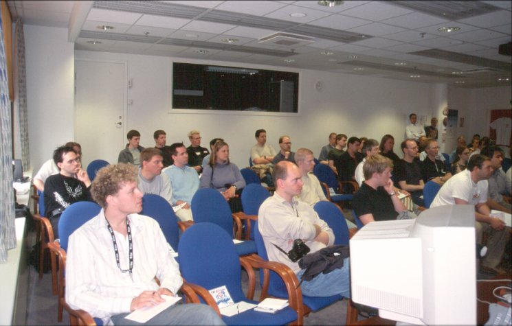14: Just a part of the many interested listeners. It was a nice room, equipped with the best in AV technology, e.g. a data projector system, which came in handy later. Comfy chairs, too (no, not <em>that</em> kind of comfy chair!).