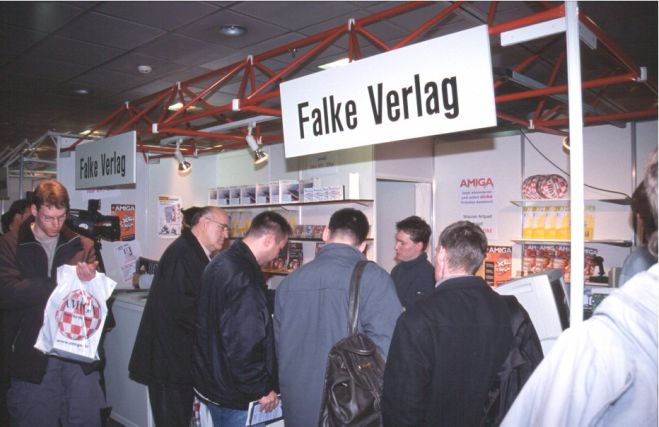 9: In the meantime, a look at the other hall. Falke Media, the organizers of the show, and a big German magazine publisher. Yes, there are still real, printed Amiga magazines in Germany.