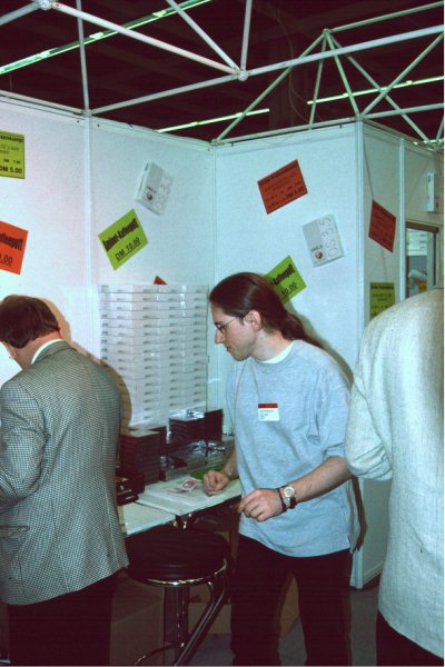 4: Urban Müller at Schatztruhe's stand - note the stack of OS 3.5 packs in the background.