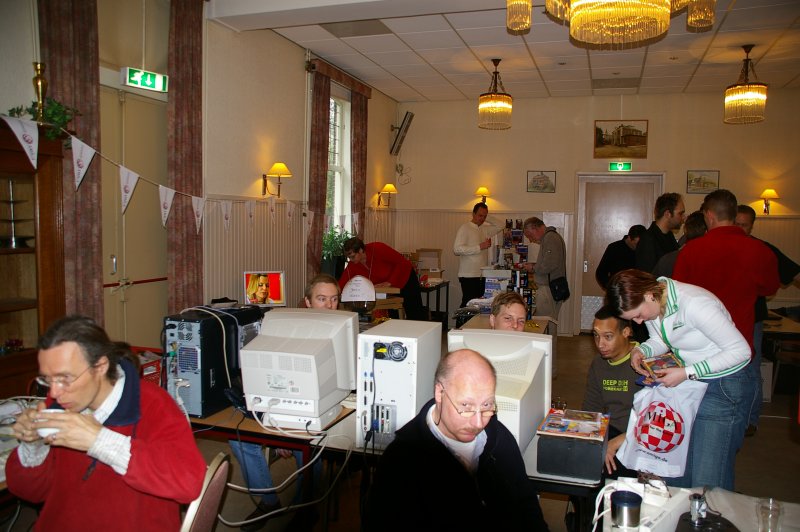 A small group of the many people showing various Commodore stuff. In the far corner, Computer City had a stand with some of their products for sale, and with a prototype of the AHT Ariana running.