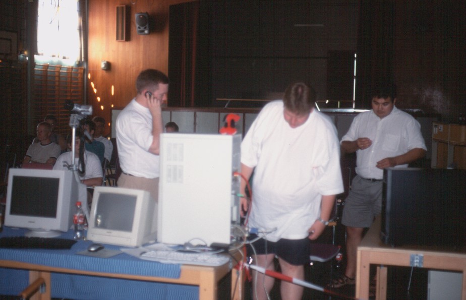 5: Jens on the blower with some latecomers on their way from the station, while Peter double-checks some cables, and Justin looks on in the background.