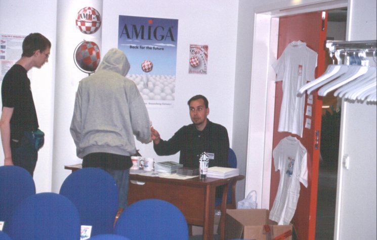 8: In the corner of the conference room, Kjell Breding (Sharakmir) from AmiGBG was manning the merchandise table, and selling well too. Yeah, I chipped in as well and bought a tour t-shirt. What you see on the door is front and back of the same model.