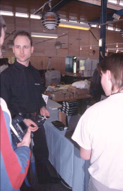 14: Jens Schönfeld arrived in the meantime, bringing with him a stack of the long awaited new Delfina sound cards. Not sure that's what he's holding, though, it might be a CatWeasel.