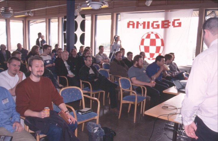 15: Some of the crowd waiting for Alan's speech. That's my chair with my newly bought Delfina card there in the foreground. Ole-Egil and Justin are on the other side of the aisle in the front row.