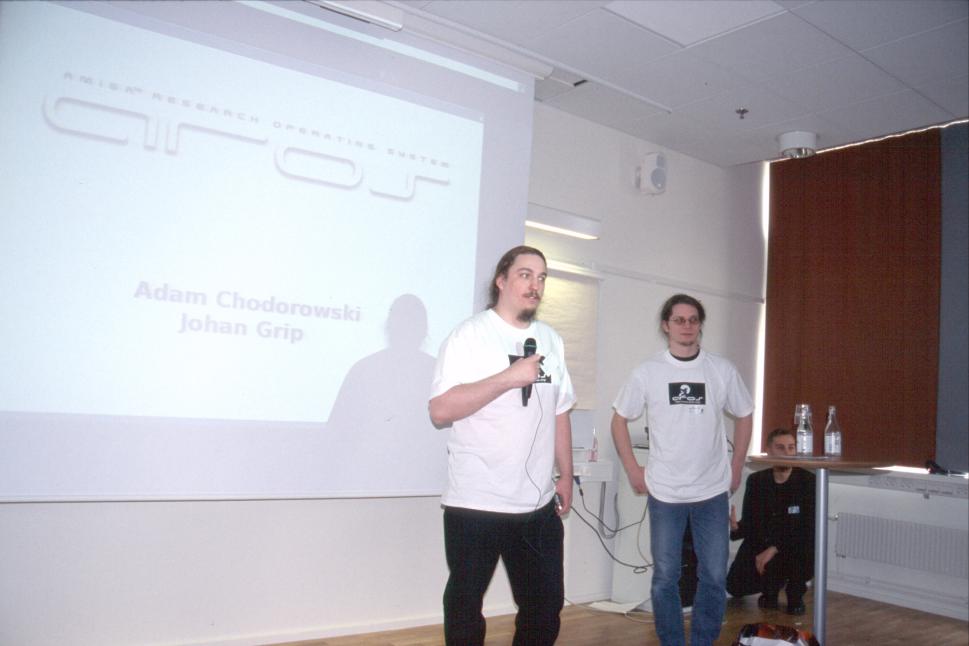 AROS presentation. Adam Chodorowski and Johan Grip. Sharakmir in the background.