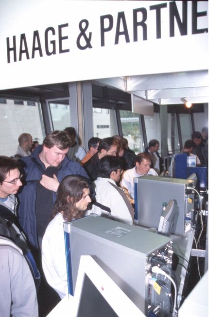12: Martin Steigerwald and Markus Pöllmann demonstrating Amithlon and AmigaXL, respectively, on two of the fancy new tower systems.