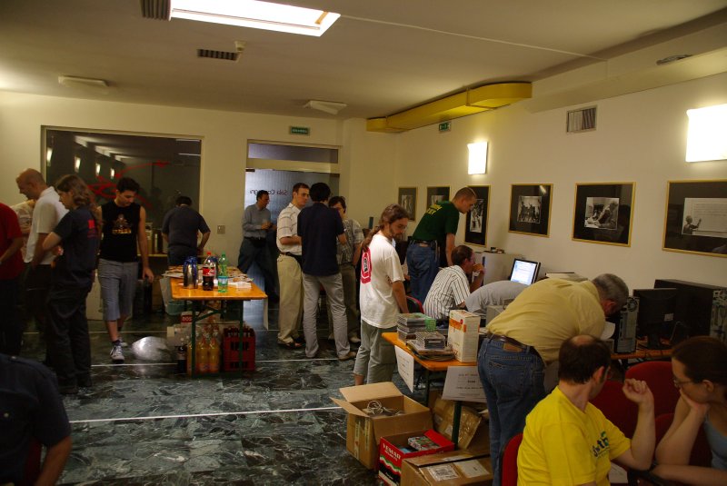 And along the opposite wall, there were two AmigaOnes with the latest OS4 prerelease, and Max Tretene (Soft3) had some of his items on display. I got a good deal on an SiI3114 SATA controller. In the foreground a table where the Italian site Amigaplatform.com had lots of old software and magazines etc. for sale.