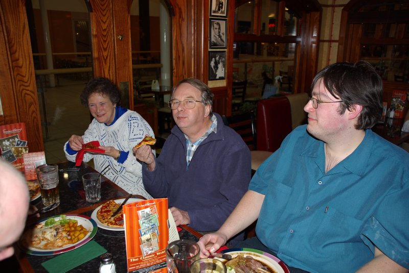 At the dinner table. Evelyn, Tony, Robert.